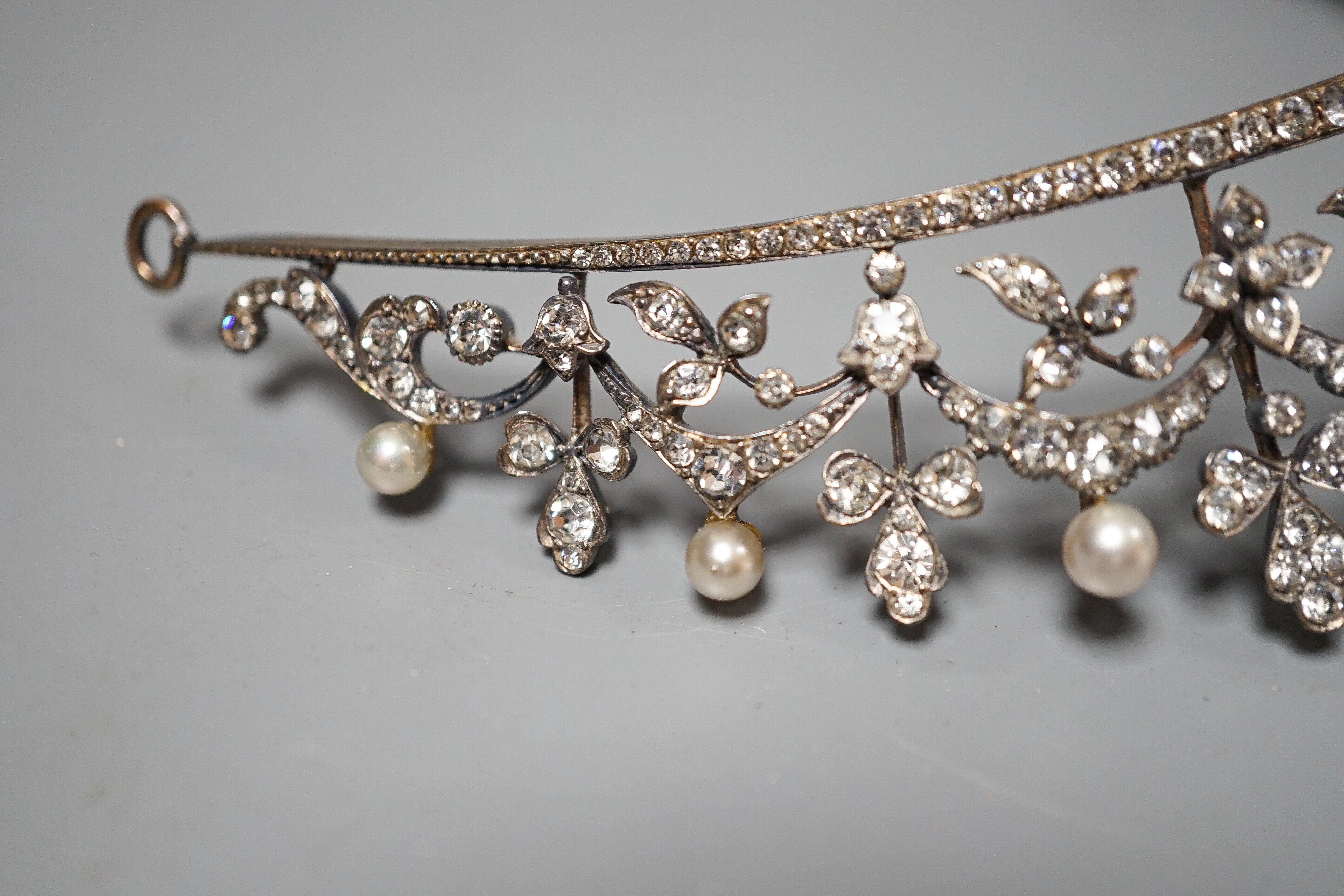 An Edwardian white metal and paste set tiara, 13cm.